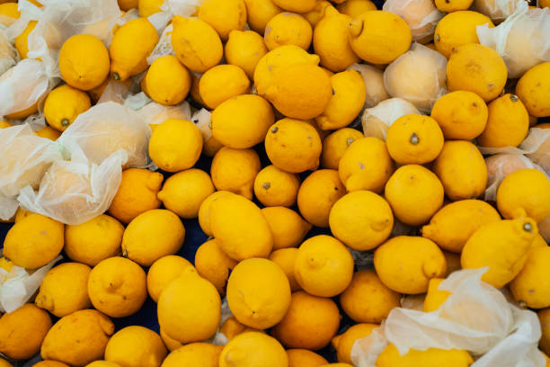 fresh lemons on natural fabric in the supermarket. Vitamin C