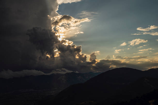 a summer sunset over the mount Volturino with a cloudy skye in the background, Val D'Agri, Basilicata