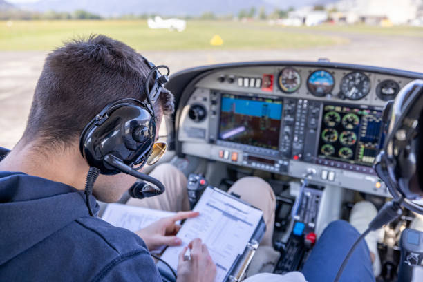 istock Pilots Preparing for Takeoff in Light Aircraft Cockpit 2164060069