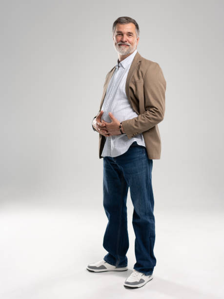 istock Smiling mature man posing isolated on white background 2164061242