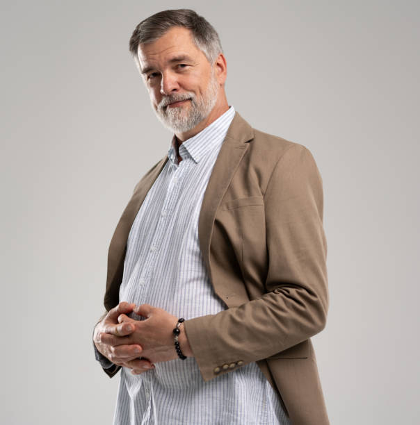 istock Smiling mature man posing isolated on white background 2164061243