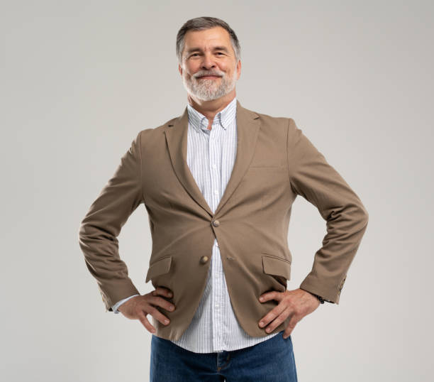 istock Smiling mature man posing isolated on white background 2164061257