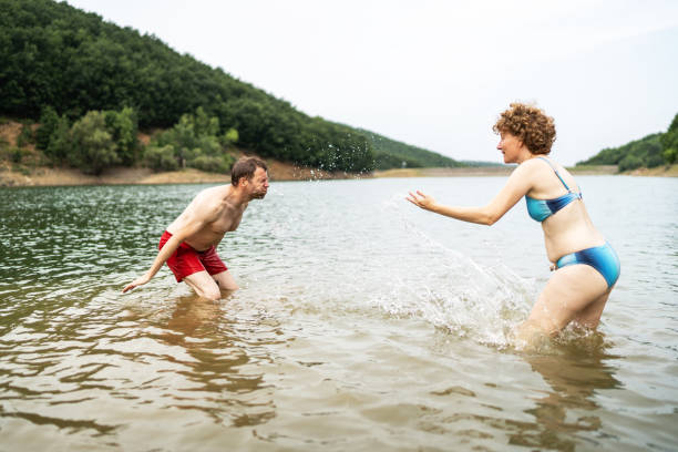 istock Friends enjoying in lake 2164061995