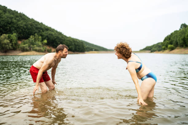 istock Friends enjoying in lake 2164062034