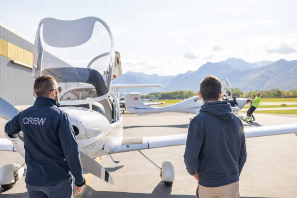 istock Ground Crew and Pilots Preparing Light Aircraft 2164063823