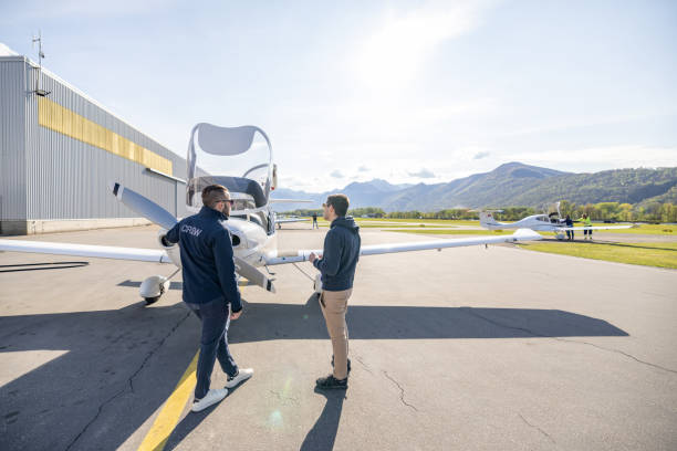 istock Ground Crew and Pilots with Light Aircraft at Airfield 2164063930