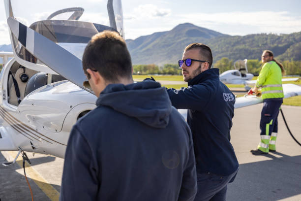 istock Ground Crew and Pilots Preparing Light Aircraft 2164064691