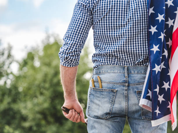 istock American Flag, attractive man in work clothes 2164064972
