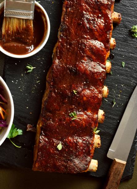 istock Bbq spare ribs on black slate dish 2164065199
