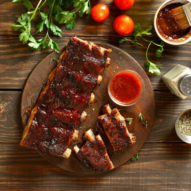 Barbecue pork ribs with sauce on serving platter
