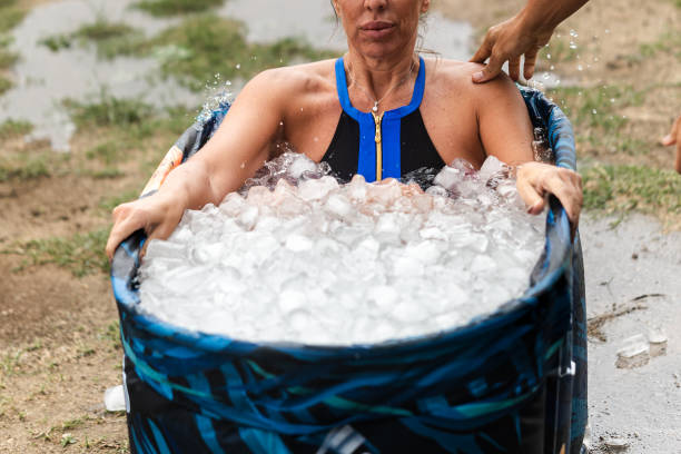 istock Athlete woman taking ice bath after running workout 2164067254