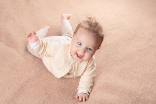 istock Little baby on white bed 2164068630