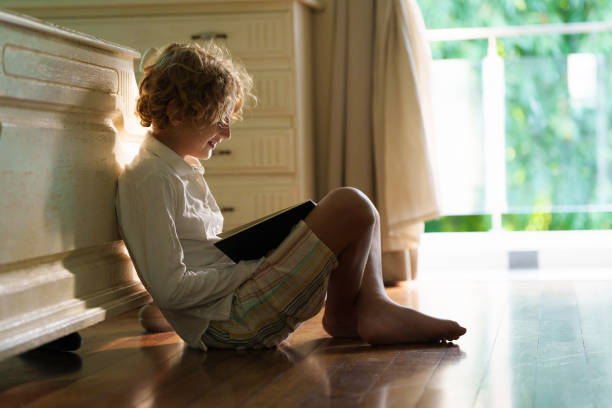 istock Child with books doing homework after school. 2164068696
