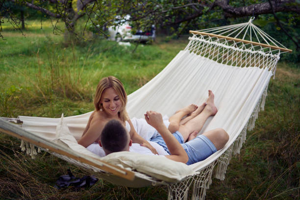 istock a loving couple in hammock, millennials 2164068913