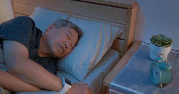 istock old man sleep with smartwatch 2164069289