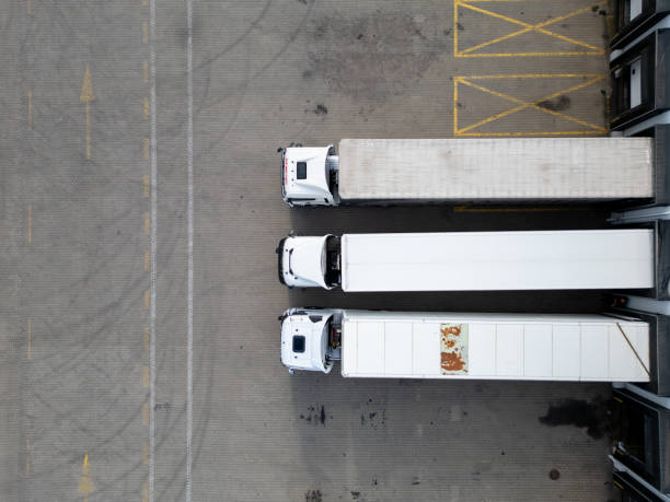 istock aerial view of Trucks at a Loading Dock in distribution center 2164069305