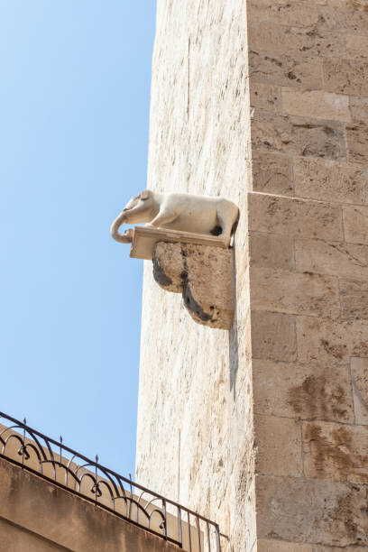 Stone elephant statue on the Torre dell'Elefante, a medieval tower in Carriage,