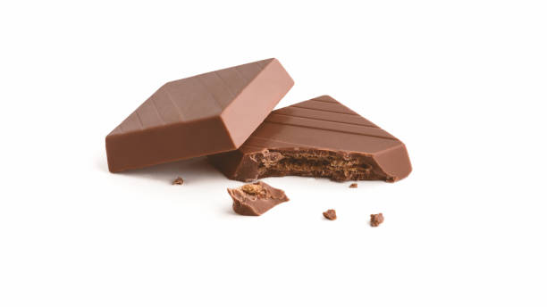 istock Milk chocolate pieces on a white background 2164070467