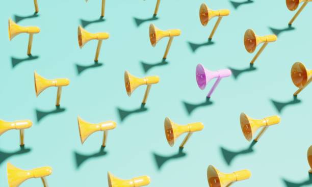 istock Pink colored megaphone standing out from the crowd 2164073772