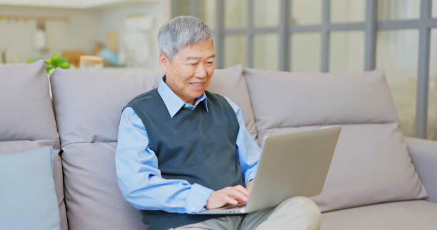 istock asian elderly man use laptop 2164075841