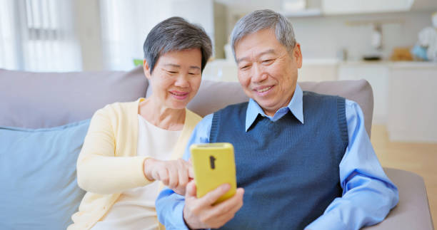 istock asian old couple use smartphone 2164076203