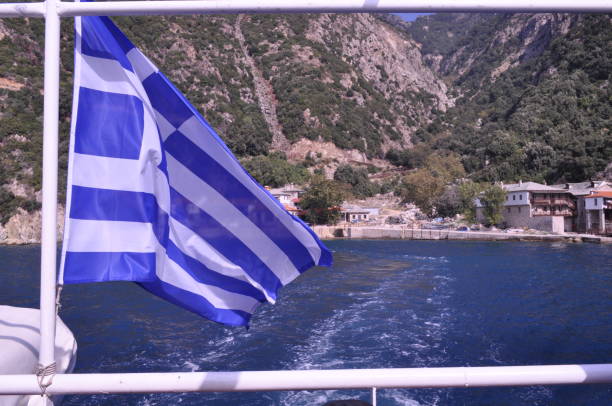 istock Greece flag on the flagpole 2164077464