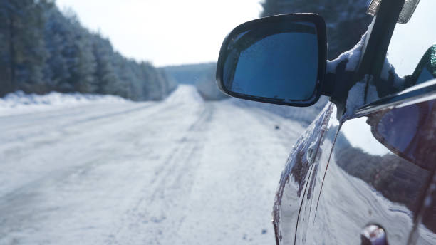 istock A red car stands on a snow-covered road 2164078838