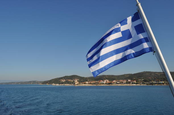 istock Greece flag on the flagpole 2164084756
