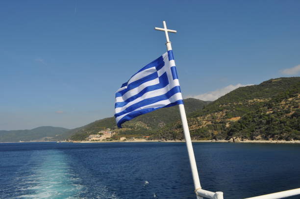 istock Greece flag on the flagpole 2164084807