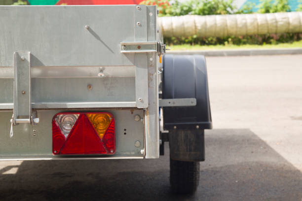 istock Open road trailer. Shop selling car trailers. 2164090215