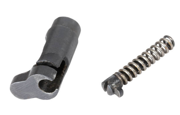 Handgun magazine release mechanism disassembled