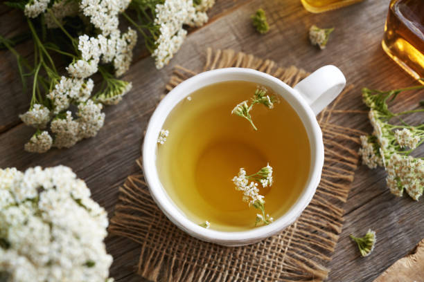 istock Yarrow tea in a whtie ceramic cup on a table 2164101837