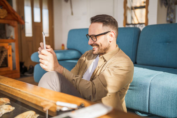 istock One Man caucasian Holding Digital Tablet work at home Happy Smile 2164103884