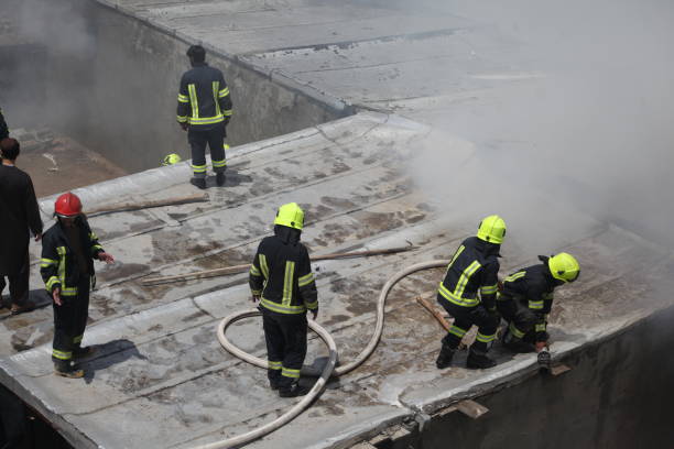 KABUL,  AFGHANISTAN - 04 June 2019: Old Market parts of dried fruit market got on fire it took hours to firefighters to extinguish the fire. A significant fire broke out at the Milad Supermarket in one of Kabul's busiest trading areas, resulting in extensive financial losses estimated in the millions of Afghanis. Despite the early hour, the blaze quickly engulfed the multi-story building and spread to an adjacent structure. The response from the firefighting units was reportedly delayed, exacerbating the situation as the fire continued to rage for several hours. The late arrival of emergency services likely contributed to the extensive damage and the prolonged duration of the blaze, highlighting potential issues in emergency response and infrastructure within the city. June 04, 2019: Kabul Afghanistan.