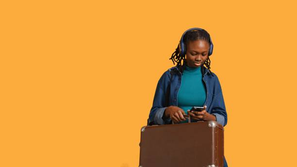 istock Girl going on vacation, travelling with suitcase, studio background 2164104967