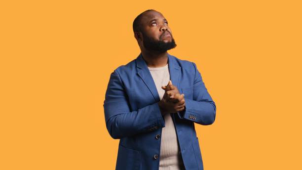 istock Happy man pleased with himself, feeling blessed, studio background 2164106811