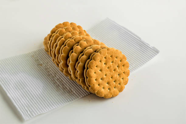 Close-up taken of round,sweet biscuits in own package at the white background.