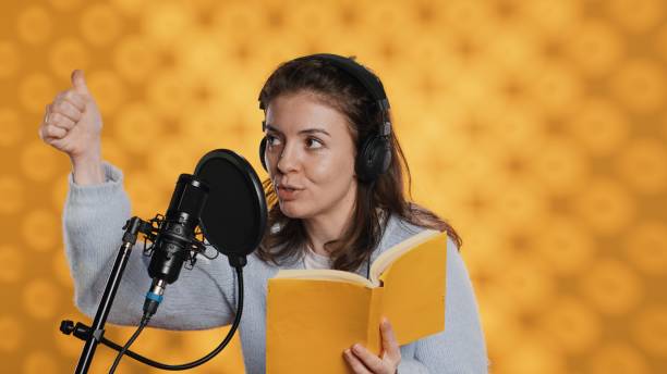istock Narrator doing counting on fingers gesturing before producing audiobook 2164109500