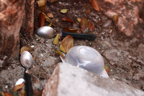 istock Spoons and Yogurt Pot Thrown into the Ground 2164113054