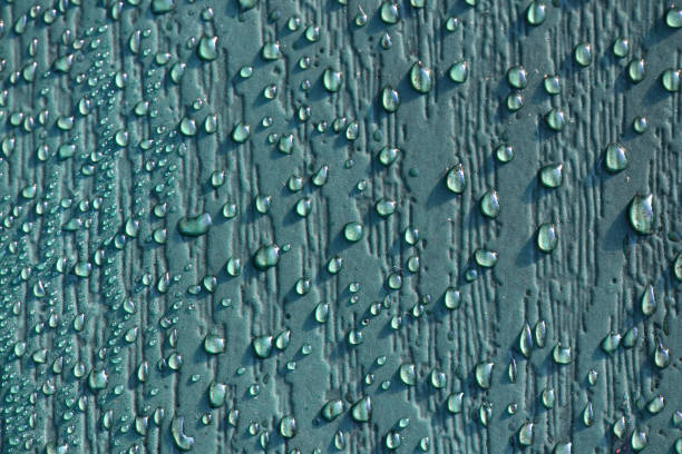 Water Drops on a wood textured plastic board