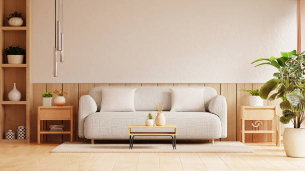 istock Bright and airy living room features a light grey sofa adorned with white cushions, set against a wooden backdrop- 3D rendering 2164118855