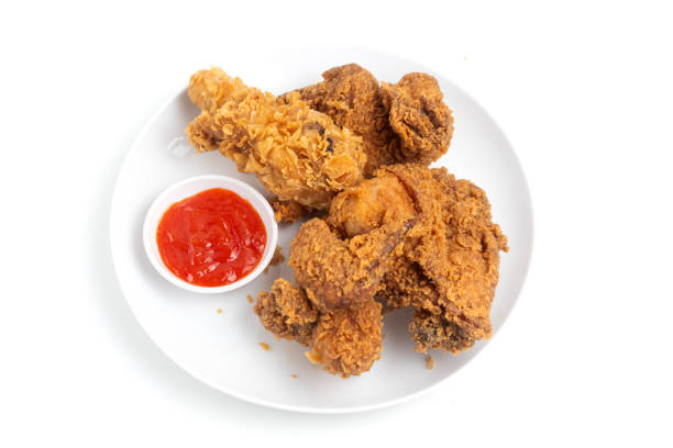 istock Crispy Fried chicken on a white plate isolated on white background. 2164124746