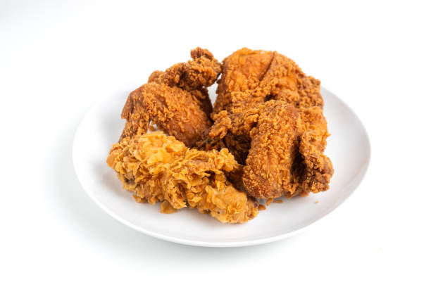 istock Crispy Fried chicken on a white plate isolated on white background. 2164124748