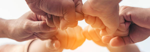 istock Banner diversity solidarity team multiethnic Partners hands together teamwork. Group of multiracial meetings joins hands together. Panorama Diversity people hands join empower trust team solidarity 2164125689