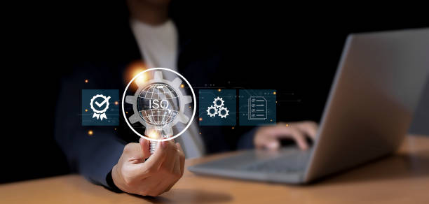 istock Businessman ISO symbol showing quality assurance on virtual screen 2164126871