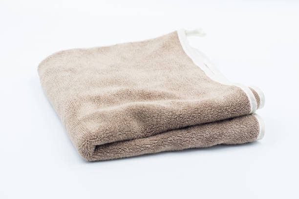 istock Clean bathroom towels laid out in rows, Rolled soft terry towel , Folded soft terry towel. 2164127702