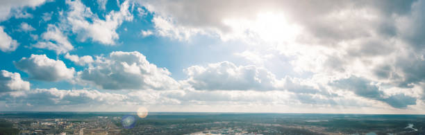 Breathtaking view of a vibrant sky filled with sunlight and clouds, perfect for scenery and nature themes.