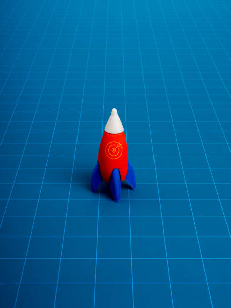 istock A small toy rocket parking isolated on blue background with online net grid pattern, minimal style. Creative innovation and ideas, inspiration, education and learning, business startup growth concept. 2164130705
