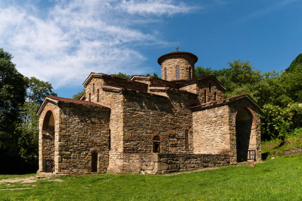 istock Ancient stone church set in green valley 2164133761