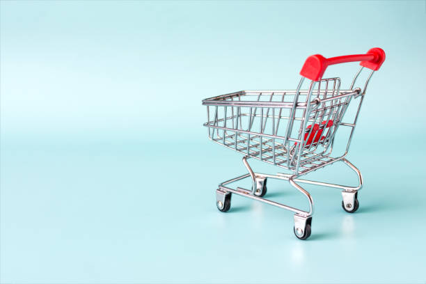 istock An empty grocery basket with colored handles in close-up on a light background. 2164134343